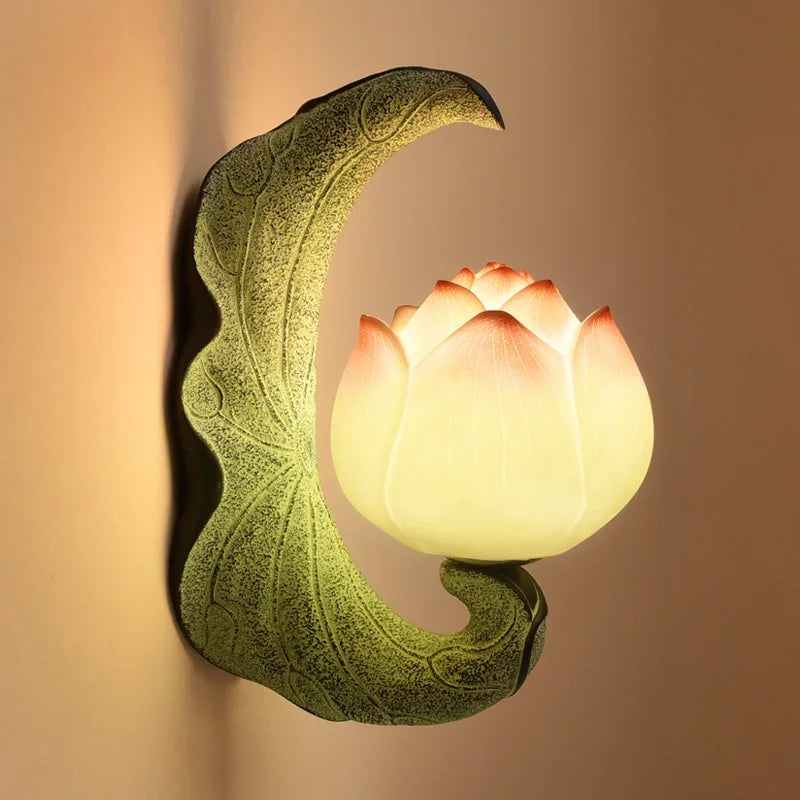 Decorative wall light shaped like a crescent moon with a lotus flower on a beige background