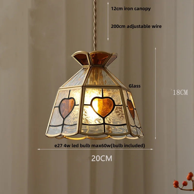 Stained glass pendant light with heart designs and measurement details on a neutral background. Colourful Tiffany E14 pendant for restaurant, dining, or hotel lighting.