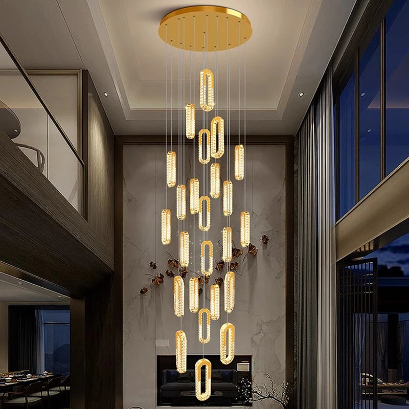 Modern chandelier hanging from a ceiling in a stylish interior setting.