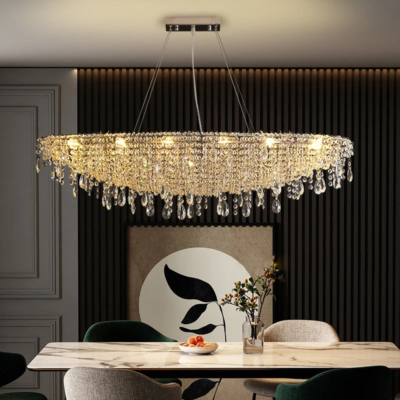 Contemporary crystal pendant chandelier hanging above a luxury dining room