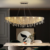 Contemporary crystal pendant chandelier hanging above a luxury dining room