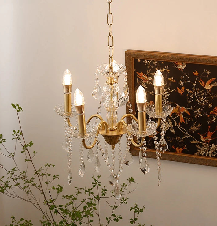 “Luxury farmhouse chandelier with crystal details and gold finish”