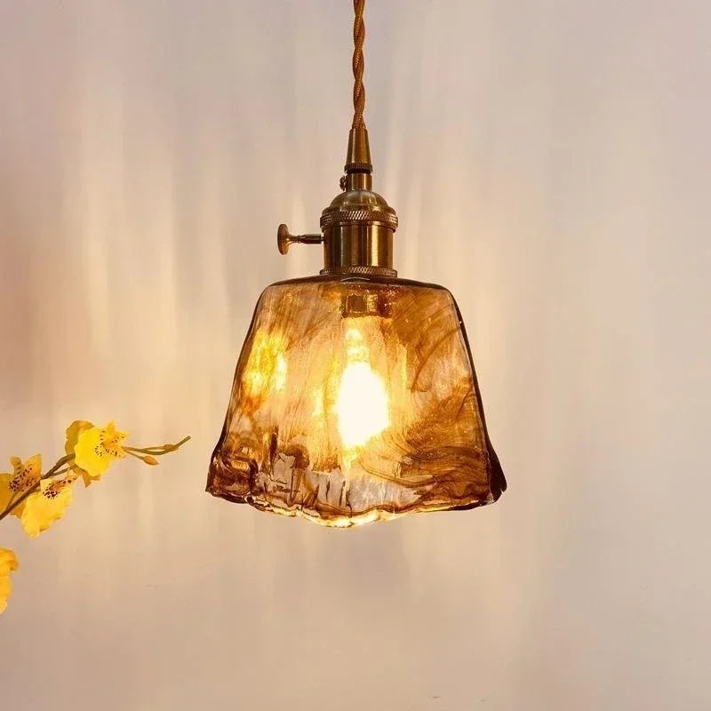 “Cozy bedside lamp with amber glass and vintage style”