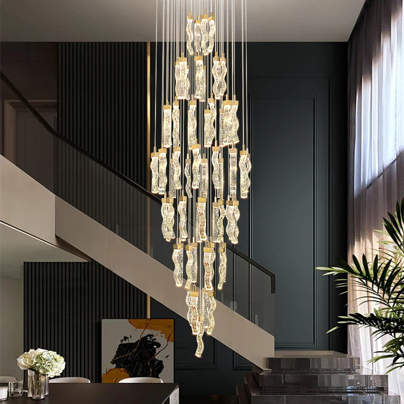 Crystal stair pendant lighting for upscale home entryway spaces