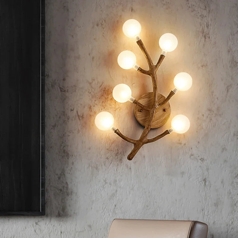 Sculptural wall light fixture with multiple globes for corridor lighting