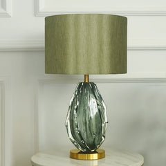 “Modern accent lamp with textured green drum shade for desk or bedside”