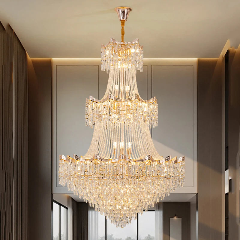 Luxurious chandelier hanging in a room with neutral walls and a window.