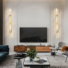 Modern living room with a television, wooden cabinet, and decorative items.