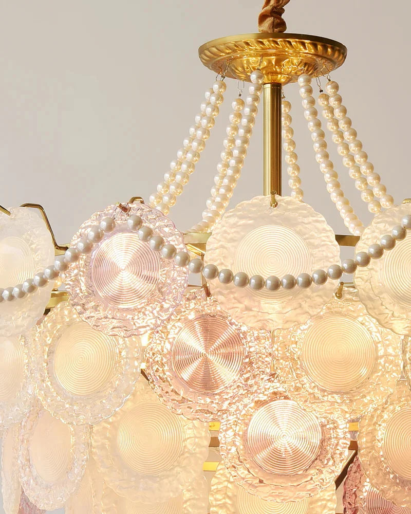 Close-up of a decorative chandelier with pearl-like beads and gold accents.