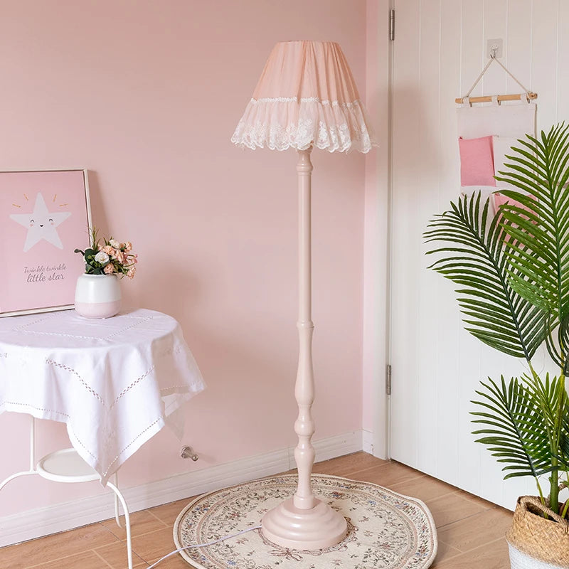 “European pink lace floor lamp with painted wood base and fabric shade”