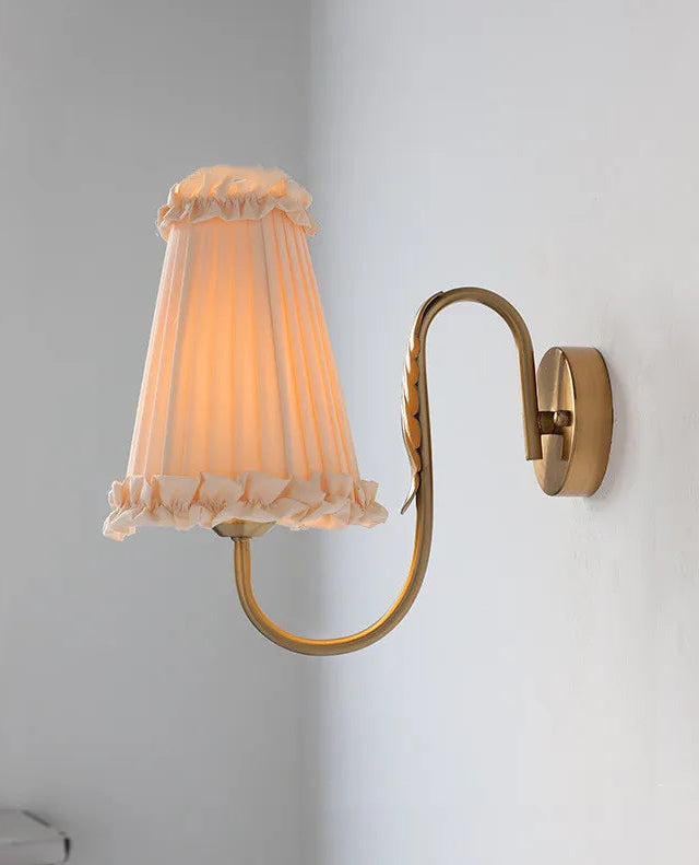 Classic retro wall lamp casting warm light in a modern minimalist room