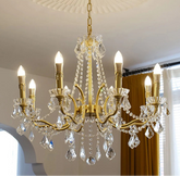 “French gold crystal chandelier with polished copper accents”