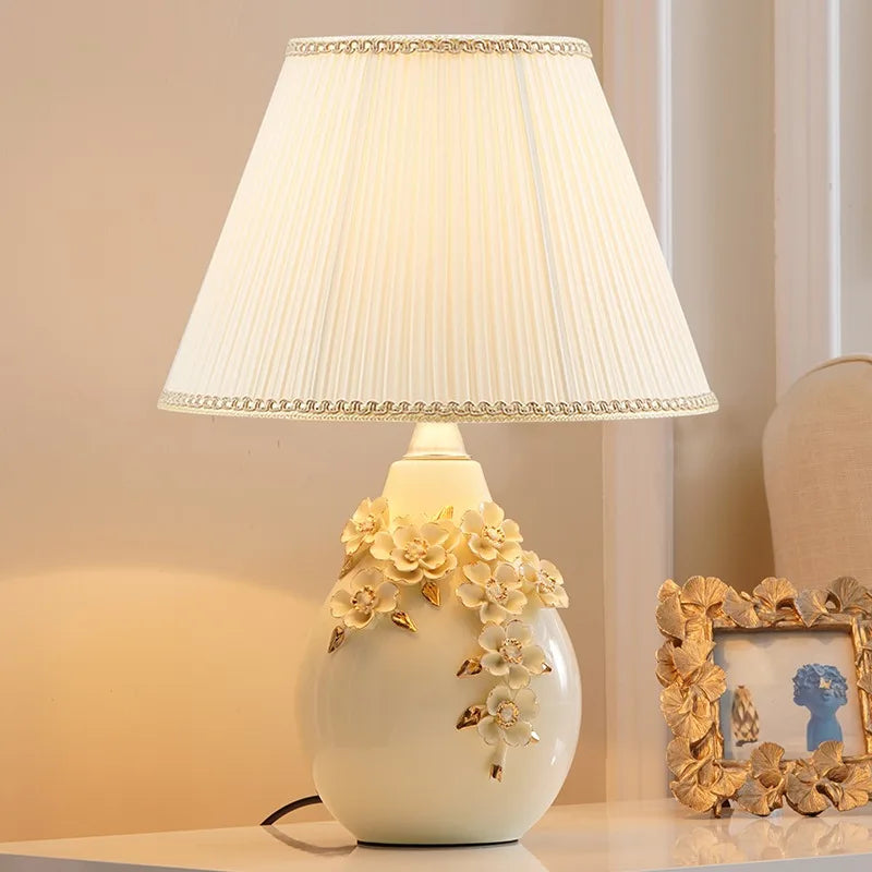 “French handmade ceramic table lamp with floral carvings”