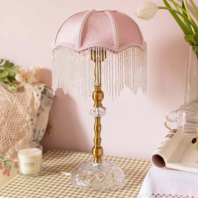 “French vintage pink tassel table lamp with beaded shade and gold base”