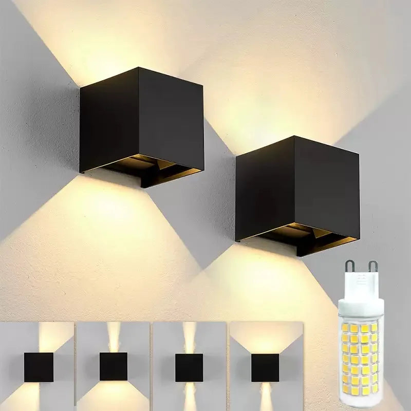“Black cube LED wall lamp with up-and-down lighting on a modern exterior wall.”