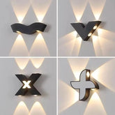 “Black geometric outdoor LED wall light projecting multi-directional beams.”