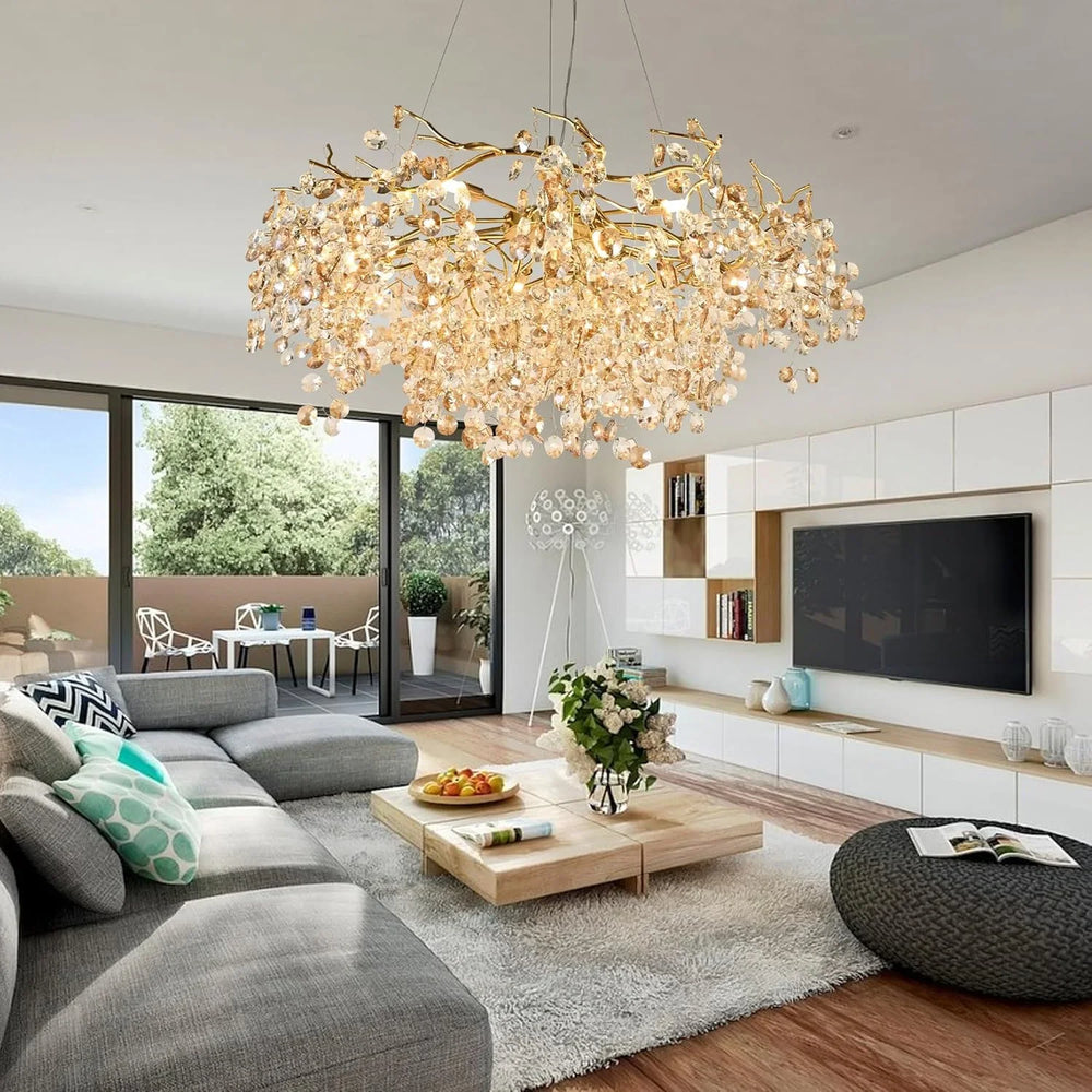 Modern living room with a large chandelier, gray sofa, and coffee table.