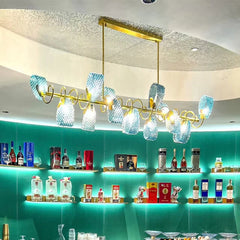 “Modern gold chandelier with blue glass for hotels or lounge seating”