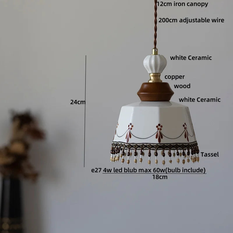 “Hand-drawn white ceramic hanging lamp with natural wood accent”