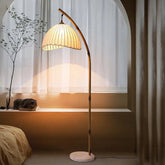 “Handmade bamboo floor lamp with rustic fabric shade”