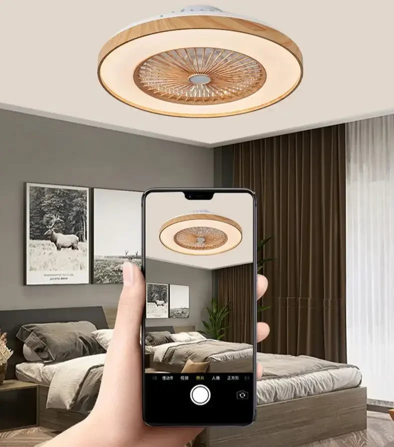 Modern 60cm remote control ceiling fan illuminating a bedroom