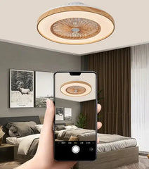 Modern 60cm remote control ceiling fan illuminating a bedroom