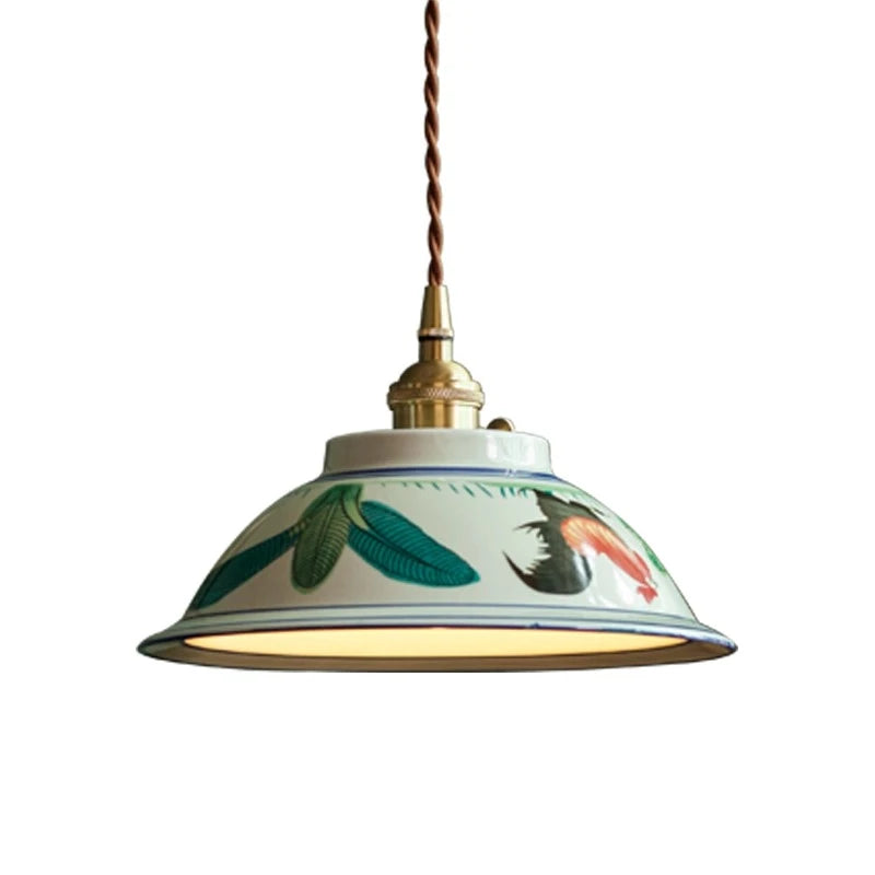 Pendant light with a floral design on a white background. Liglite hand-decorated ceramic pendant light for cozy living spaces.