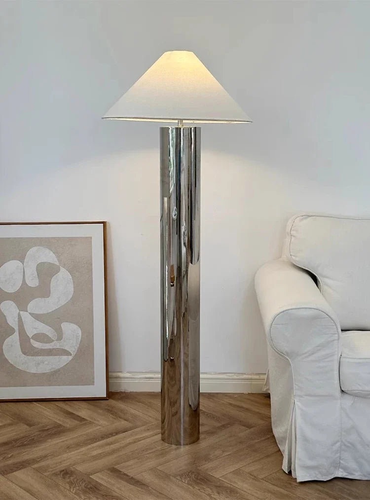 “Liglite polished steel cylinder lamp for minimalist and luxe interiors”