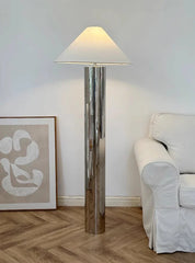 “Liglite polished steel cylinder lamp for minimalist and luxe interiors”