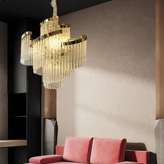 “Post-modern chandelier hanging over a seating area with reflective luxe detailing.”