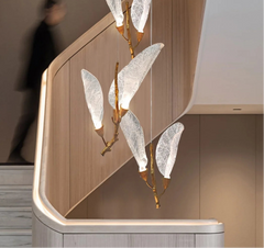 Sculptural resin leaf chandelier with warm LED glow and slim cords