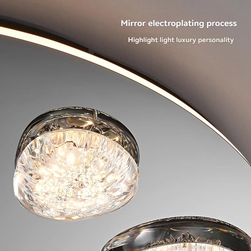 Round ceiling light with plated metal frame and clear acrylic shade design