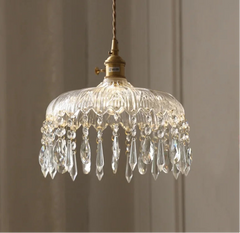 “Crystal glass pendant lamp with gold canopy and faceted drops”