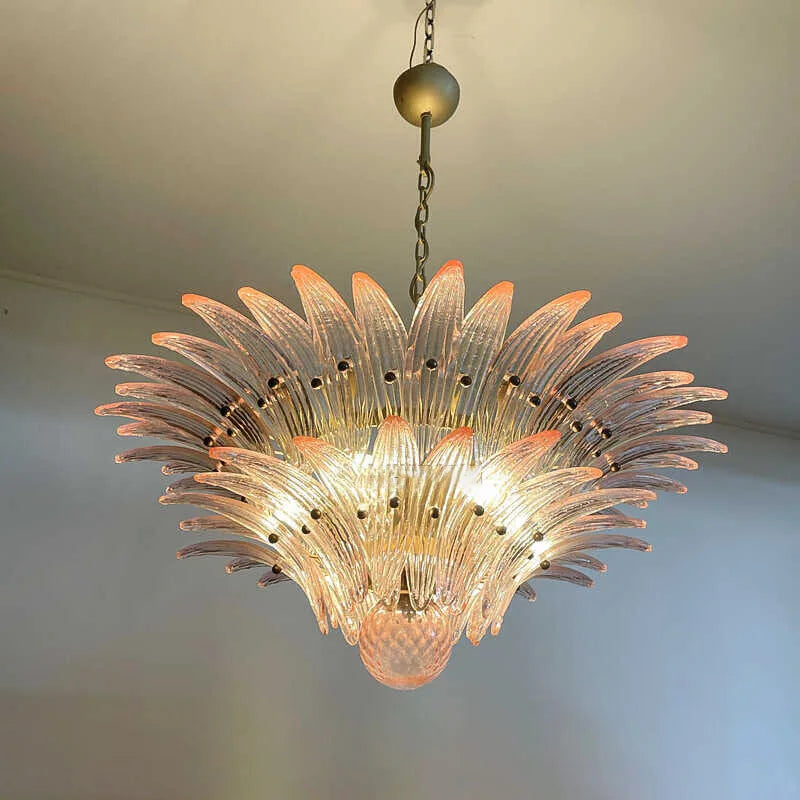 Decorative chandelier with a floral design on a plain background