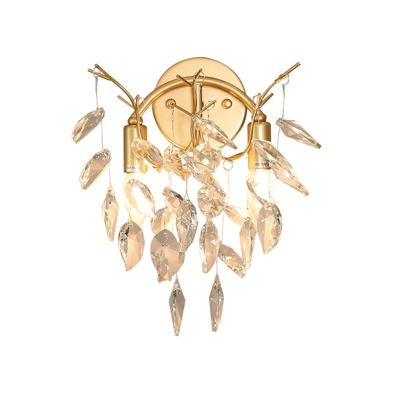 Gold wall sconce with crystal accents on a white background