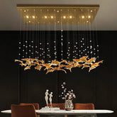 Maple leaf style glass pendant chandelier hanging above a dining table