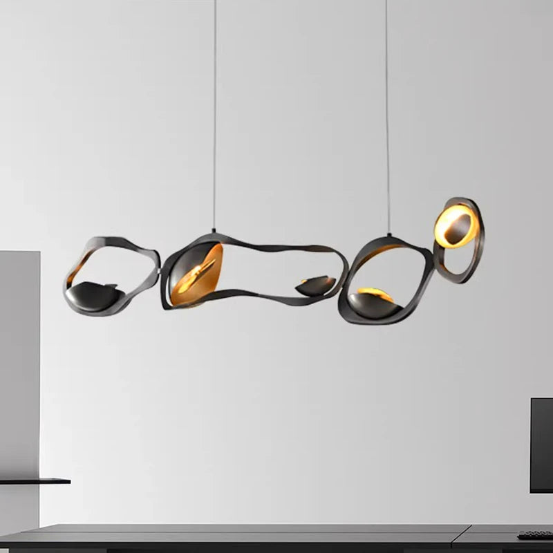 “Modern LED black gold pendant above dining table”
