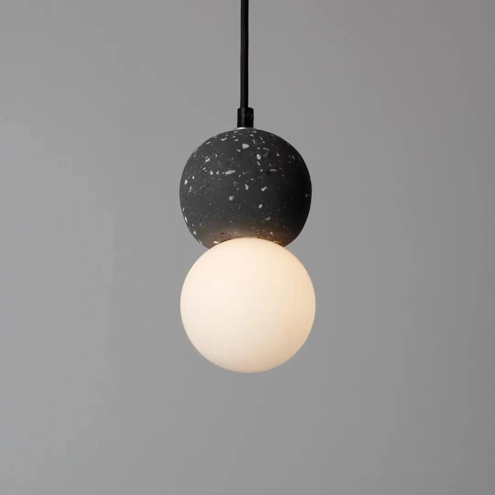 Globe pendant light with terrazzo finish for study or reading nook ambience