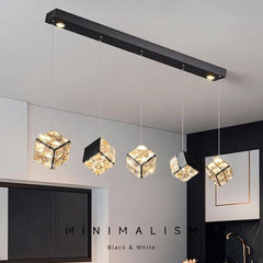 Modern pendant lights with crystal accents in a minimalistic interior setting.