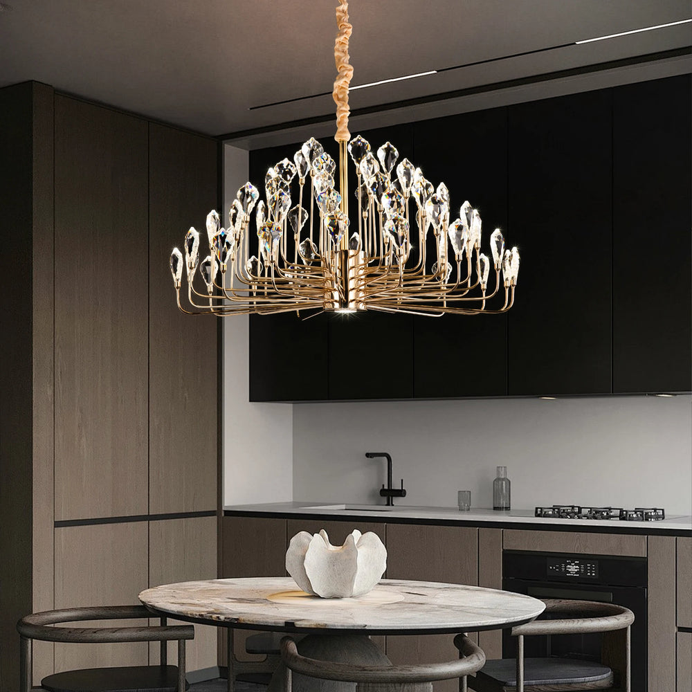 Luxury chandelier hanging above a kitchen table with modern decor.