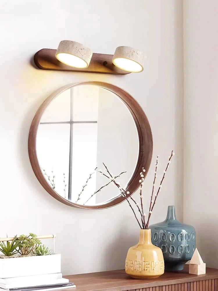 “Modern organic travertine wall lamp used as a bedside reading and ambient light.”