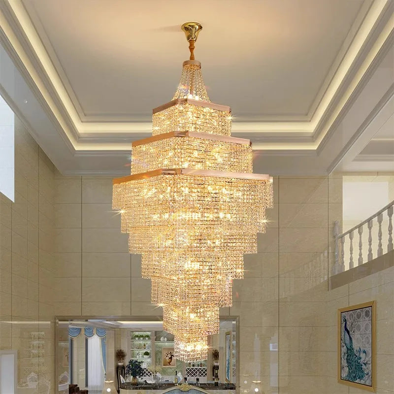 Luxurious chandelier hanging in a room with a staircase and decor.