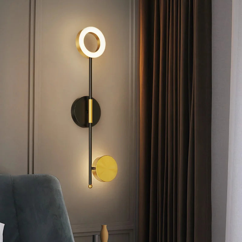 Modern round LED wall light with up and down glow for bedside wall installation