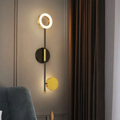 Modern round LED wall light with up and down glow for bedside wall installation