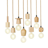 Set of hanging light fixtures with wooden bases and clear bulbs on a white background