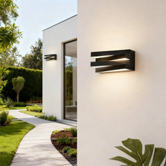 “Modern black square LED wall lamp mounted on a villa exterior wall.”