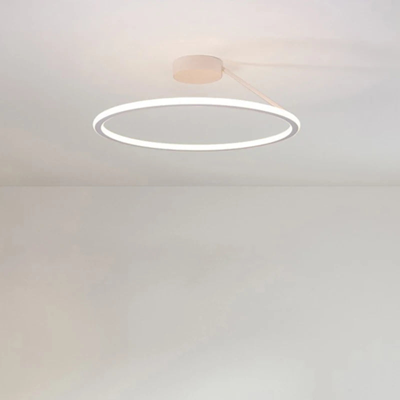 Contemporary LED ring light installed in a clean modern interior