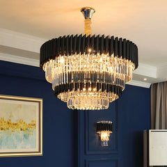 Chandelier hanging in a room with blue walls and a painting.