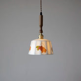 “Nordic hand-painted ceramic pendant light with wood accent”