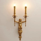 Gold wall sconce with classical design on a light background